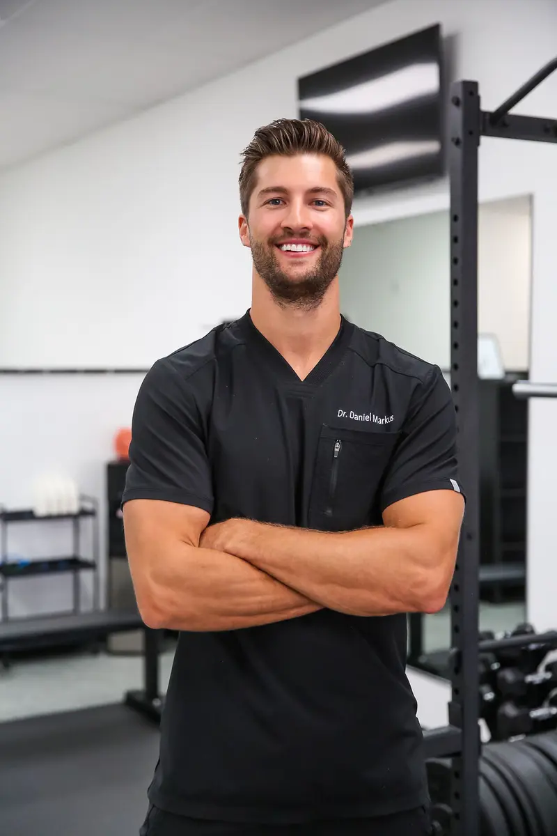 Dr. Daniel Markus performing chiropractic adjustment for Chandler patient